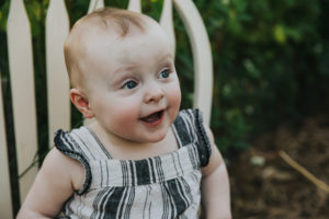 Look of surprise and happiness during a first birthday session in Hillsboro, Oregon.